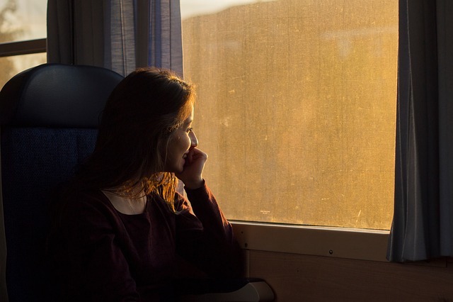 woman looking out of train window